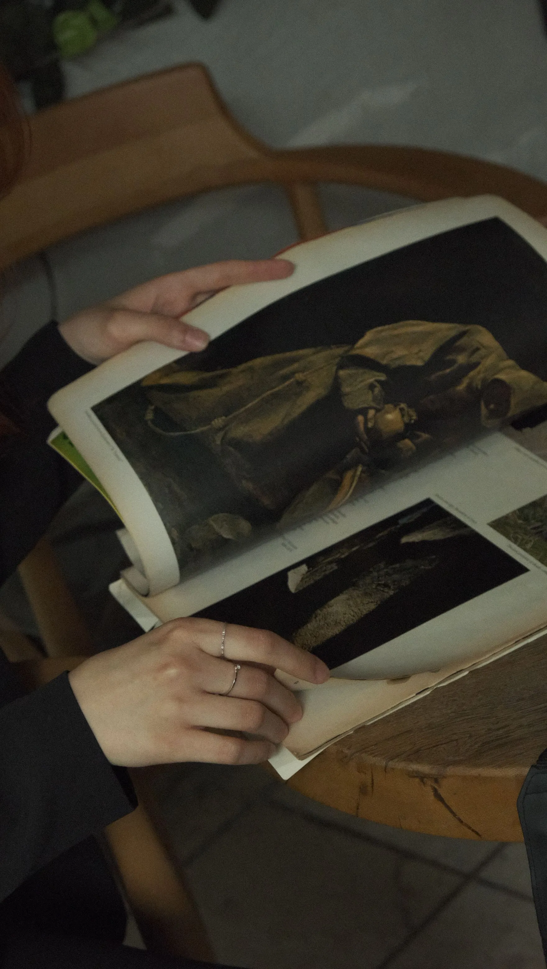 Open book showing a dark painting